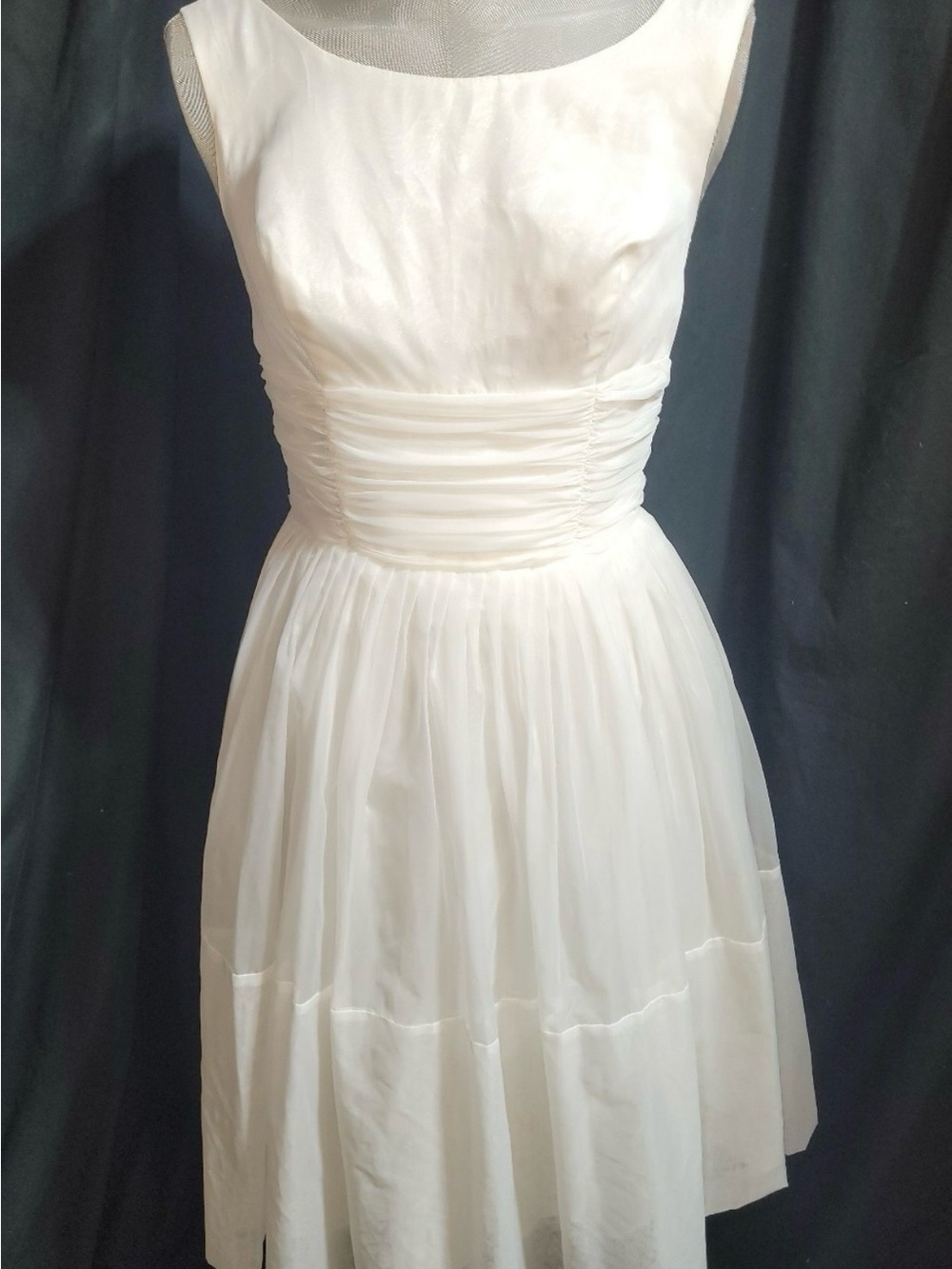 Elegant Sleeveless White Midi Dress with Ruched Waist